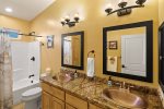 Shared hall bathroom with double sinks